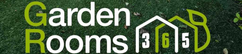 A bespoke garden room with large glass doors and wooden cladding set in a landscaped garden.